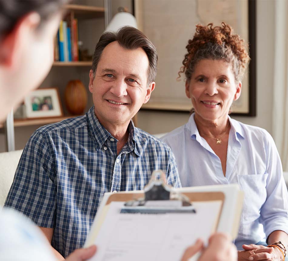 couple meeting with financial advisor to discuss successful retirement future options